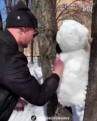 Here's how you can make a snow bunny stuck between two trees!