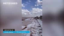 An impressive hailstorm blankets the desert of Medina, Saudi Arabia, in white
