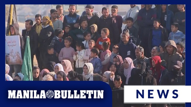 Crowd gathers as militants prepare to release more hostages