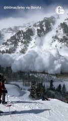 Skiers witness an avalanche come down a mountain in Utha 13 in they realize it will hit them