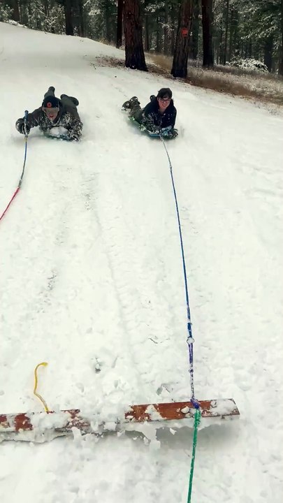 Nephew Falls Down Embankment During Snowmobile-pulled Sledding