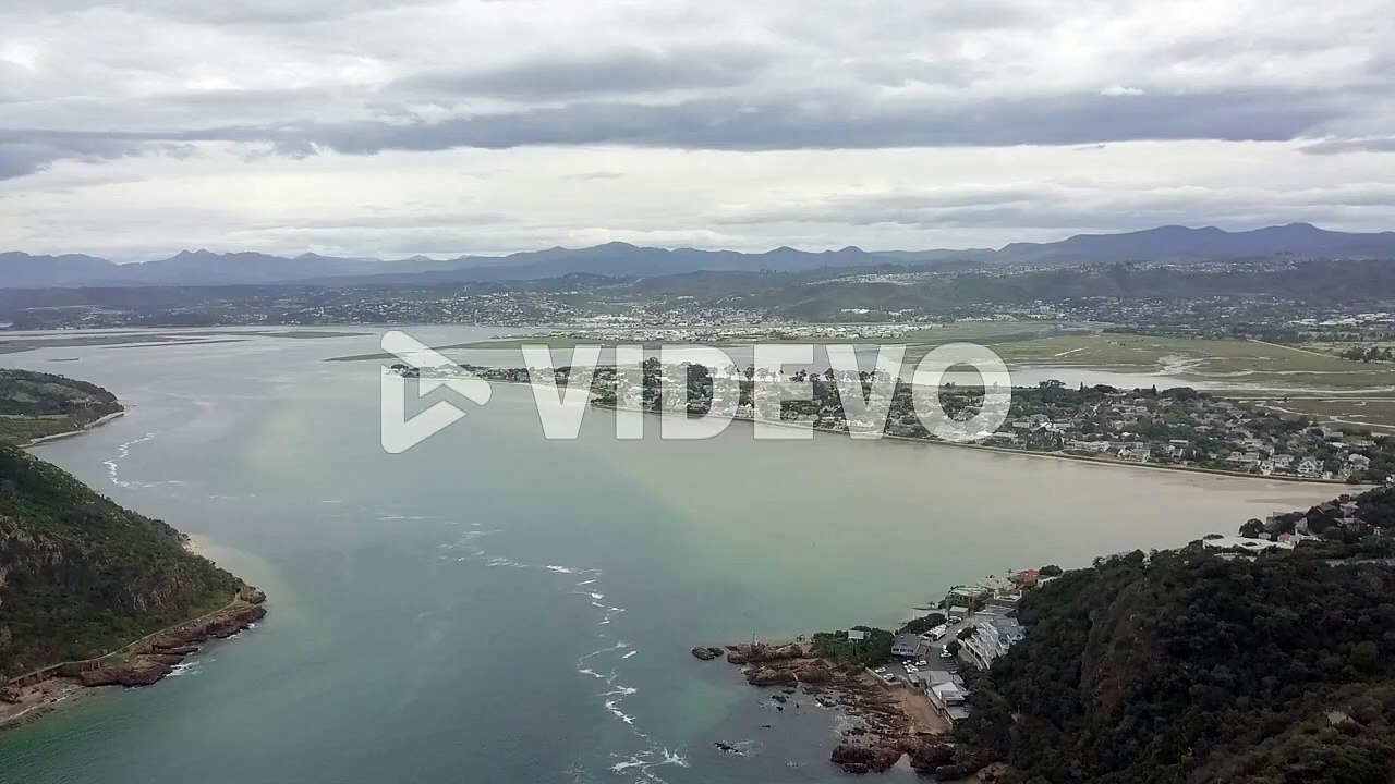 Knysna Lagoon, quiet Leisure Isle and surrounding green hills, aerial