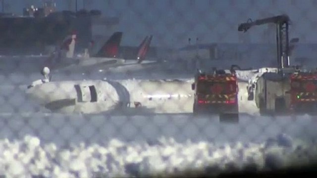Video: Delta plane lies upside-down after Toronto airport crash
