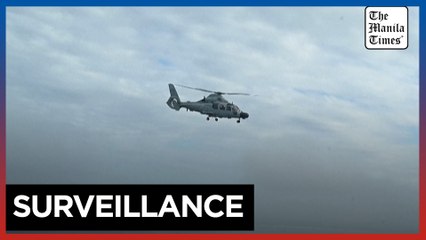 Chinese navy helicopter flies near Philippine plane carrying journalists