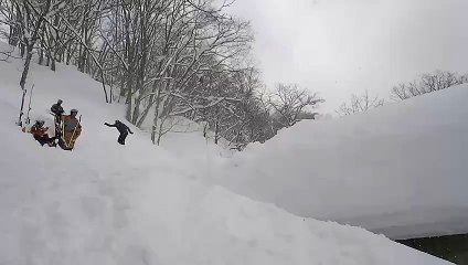 Snowboarder Falls in Snow While Attempting Jump