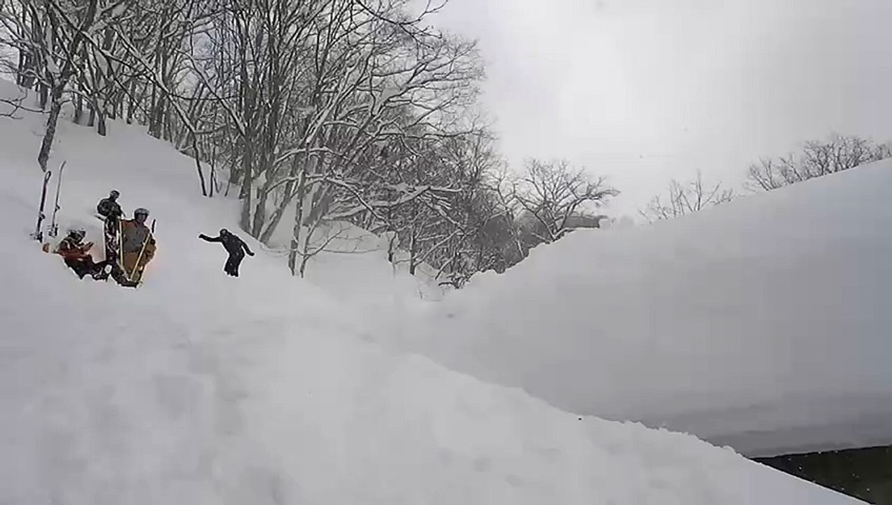 Snowboarder Falls in Snow While Attempting Jump