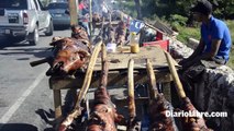 Vendedores de cerdo asado