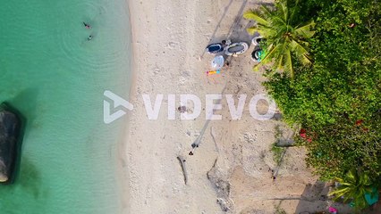aerial top down of tropical summer beach with