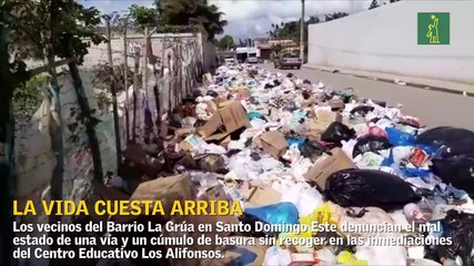 Vecinos del sector La Grúa en SDE se ahogan en basura y sufren por el estado de la vialidad