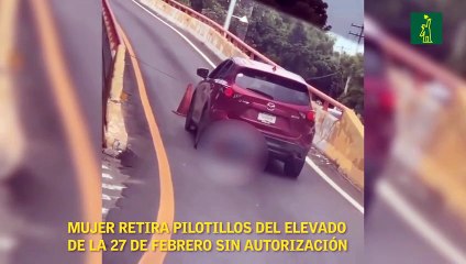 Mujer retira pilotillos del elevado de la 27 de Febrero sin autorización