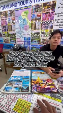 Exploring options at a travel and tour booking office in Bangkok! 🌍✈️ Ready to find the perfect adventure that suits my vibe. 🗺️✨