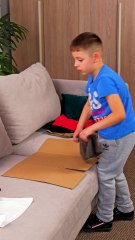 Little kid folding clothes himself, cutest ever