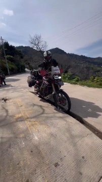 Biker Gets Stuck in Road Gap