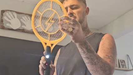 Gentleman tests the fly zapper with his finger and regrets the decision