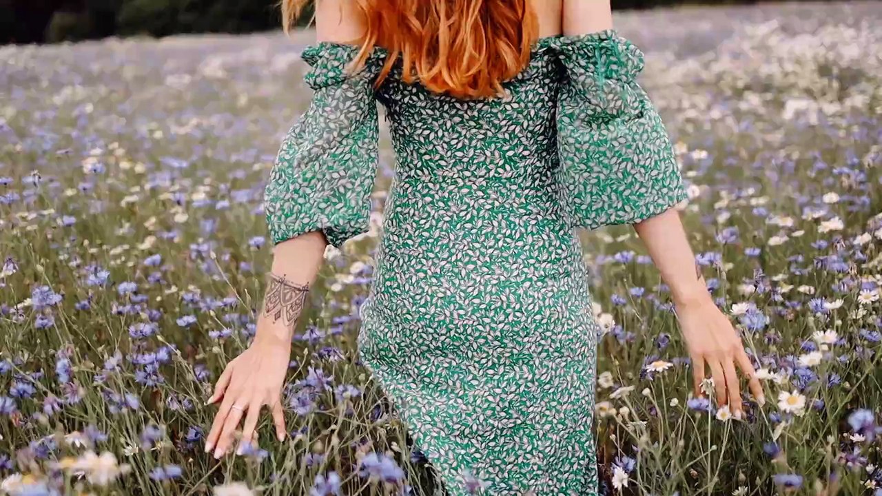 A Woman Waling In The Flower Field