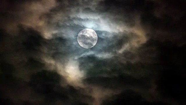 Moon and Clouds in the Night Sky – A Magical Nighttime View