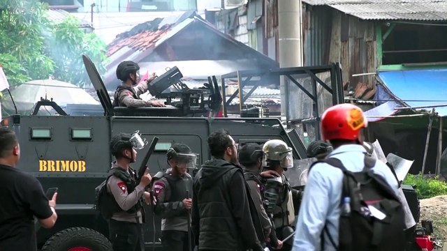 Indonesian police clash with protesters against MP salaries