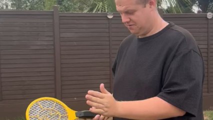 Man underestimates a fly zapper and  gets zapped on the finger