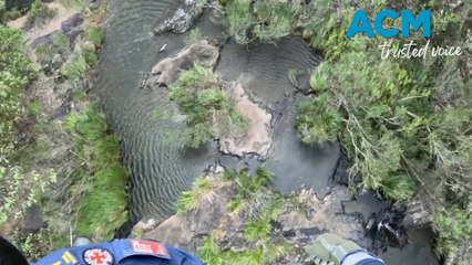 Teenager rescued after fall from Queensland waterfall