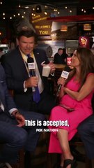 Pete Hegseth showing off what appears to be an alcoholic beverage