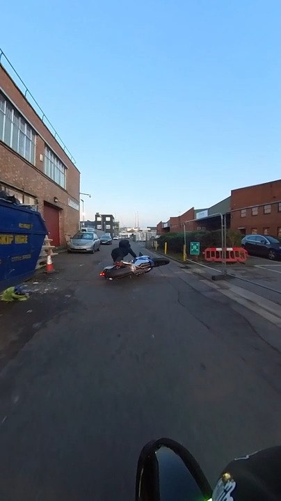 Motorcyclist Skids on Oil and Falls