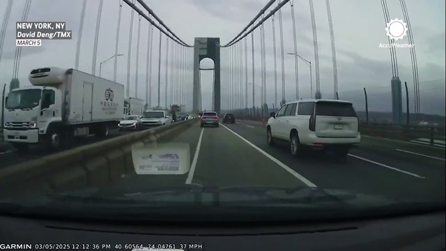 High winds flip board onto car's windshield on New York City bridge