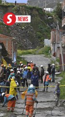 Bolivians salvage belongings, pets from wrecked homes after landslide