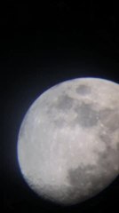 Person Captures Moon as Plane Passes Right in Front of It