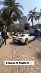 Sports Car Hits Curb While Turning onto Road