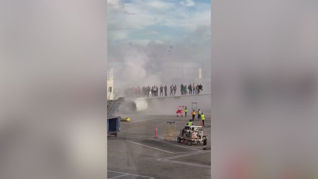 New footage revealed: passengers escape onto wing as American Airlines plane burns in Denver