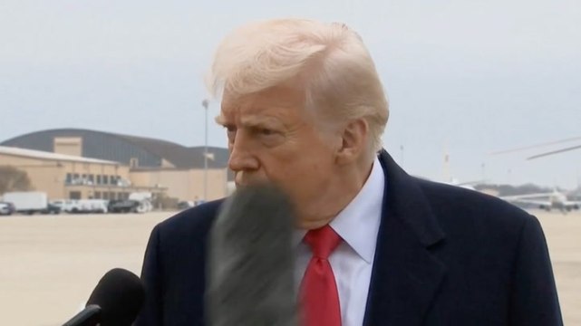 Donald Trump stares down reporter after microphone hits his face