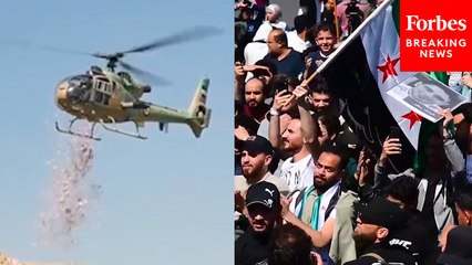 Helicopters Drop Flowers Over Crowd In Damascus On The Anniversary Of The Uprising Against Assad
