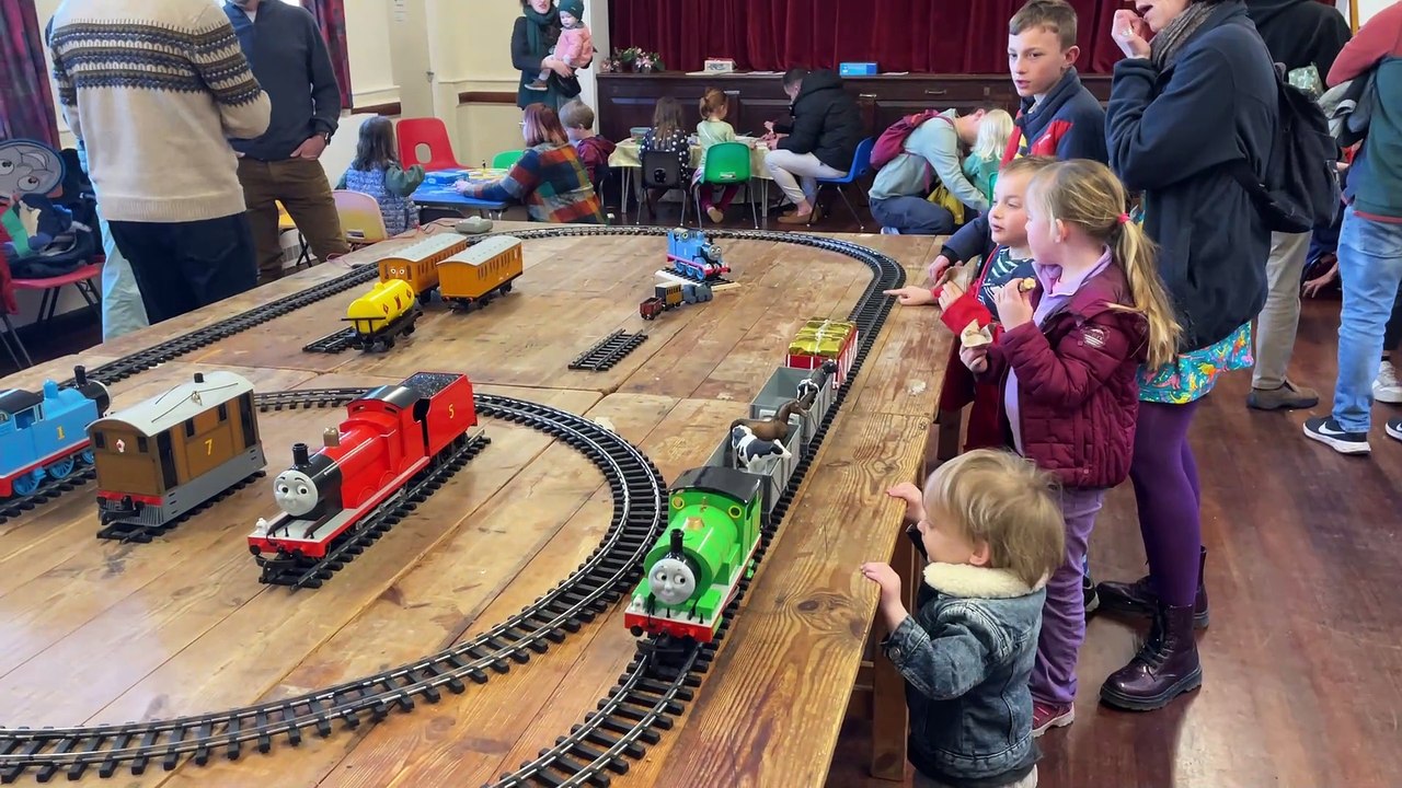 Children watching electric models of the trains  (Will Goddard, Crediton Courier)