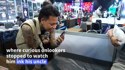 Nine-year-old Thai tattooist makes his mark