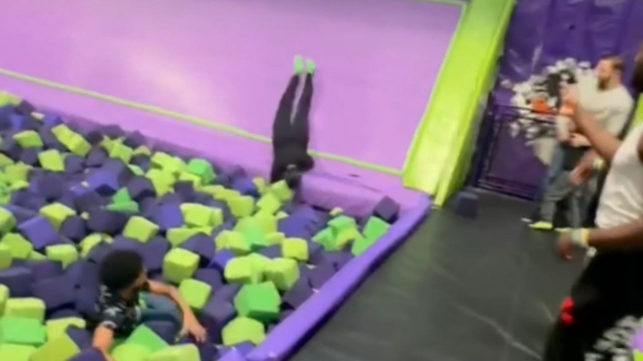 Boy attempts wall run at trampoline park but falls straight into foam pit