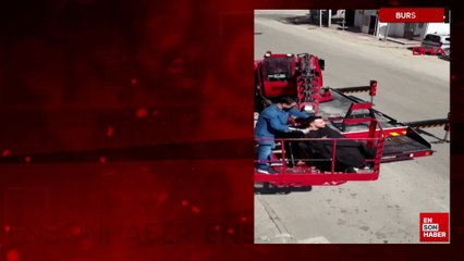 Bursa'da vinç sepetinde saç tıraşı yaptı