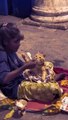 Girl Sitting by Roadside Shares Her Milkshake With Cat Using Her Own Spoon