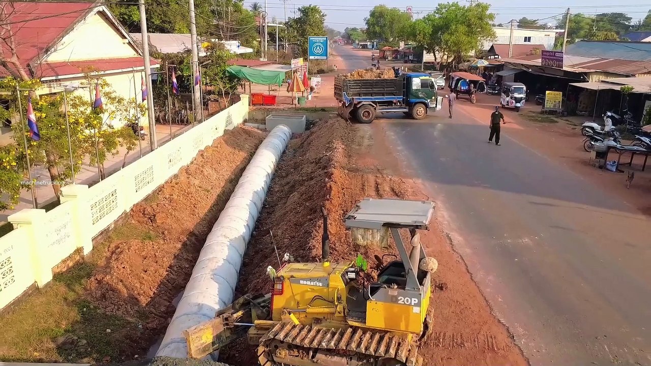 Processing by dump truck _ bulldozer push soil bury 27 sewer drainage system near the school