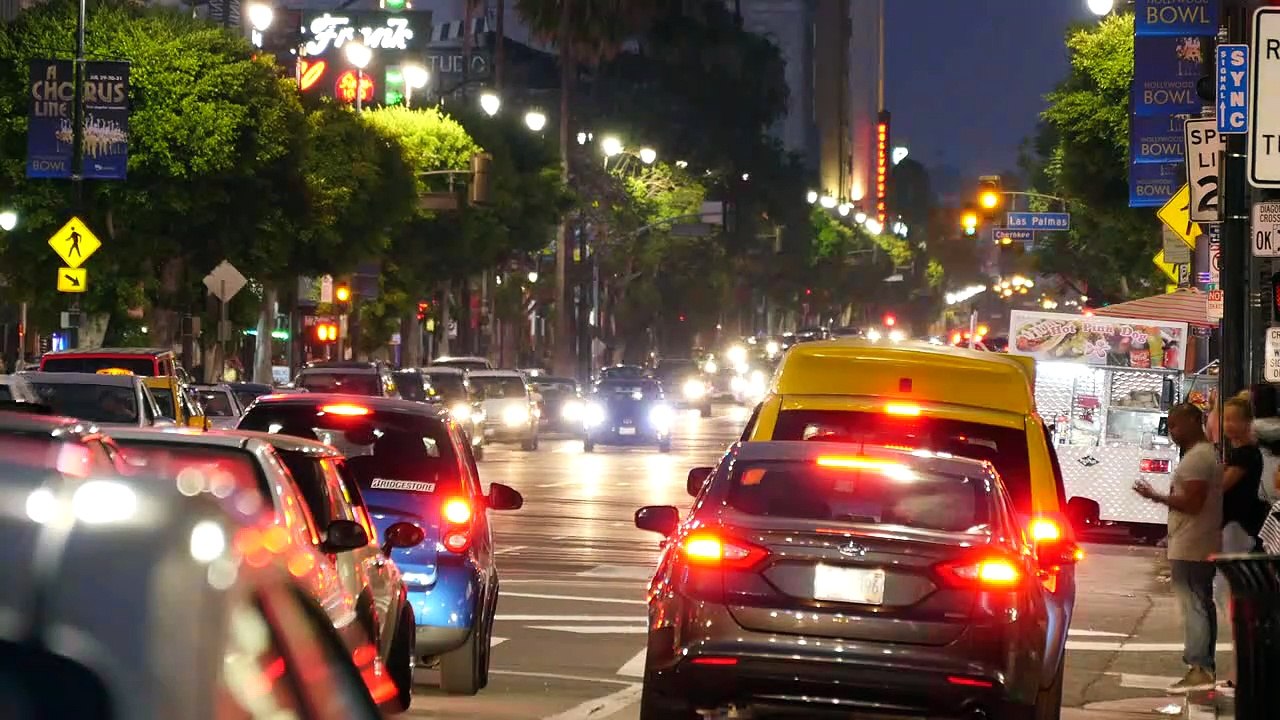Los Angeles Evening Traffic On Hollywood Boulevard Moves After Light Turns Green Time Lapse