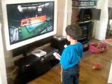 Theo playing the Wii sports