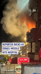 WATCH: Reporter ducks as Israeli missile hits hospital