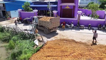 A new project is underway to clear the former flooded rice fields using a mini bulldozer.