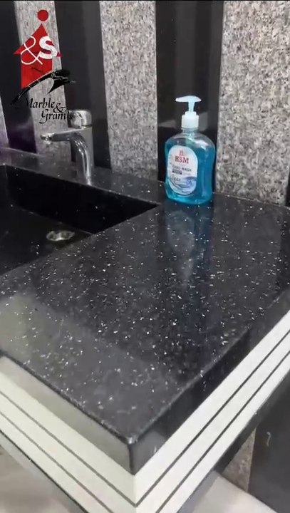 BLACK GRANITE VANITY.
