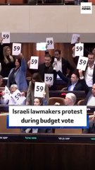 Israeli lawmakers protest during budget vote