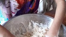 Helping my mother making dough for rotis