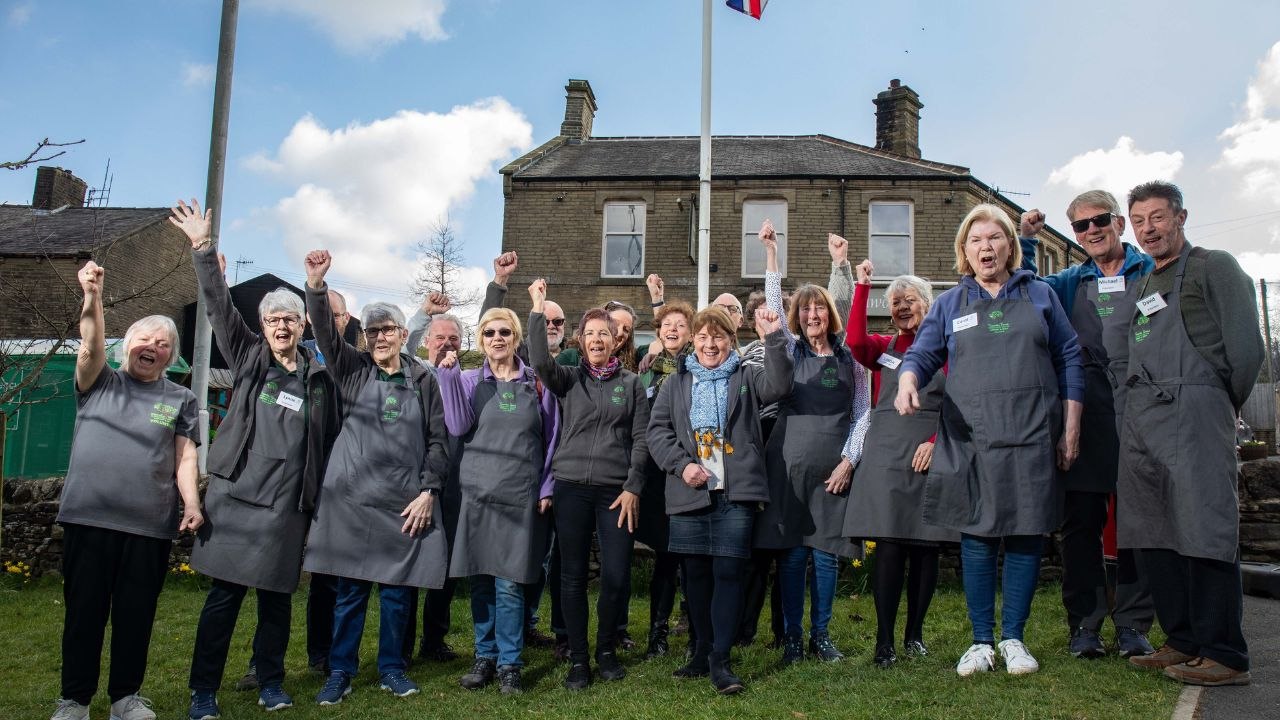 Village run by residents who own pub, library, shop, post office and hall