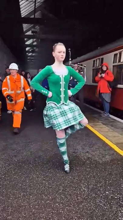 Historic train visit dancer and piper at Wick Railway station mp4
