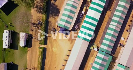 Top down aerial footage of the stables at an equestrian park