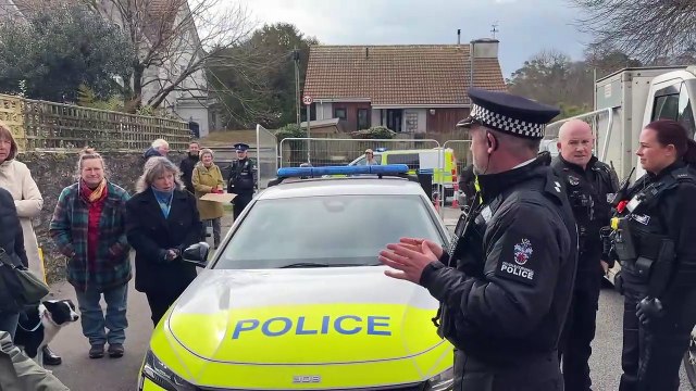 Inspector Rick Milburn announces to the protesters that the police have decided to stop the felling of the trees by Cornwall Council