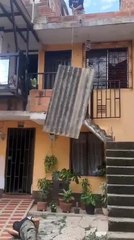 Man Falls Off Stairs While Trying to Catch Tile Sheet of Roof